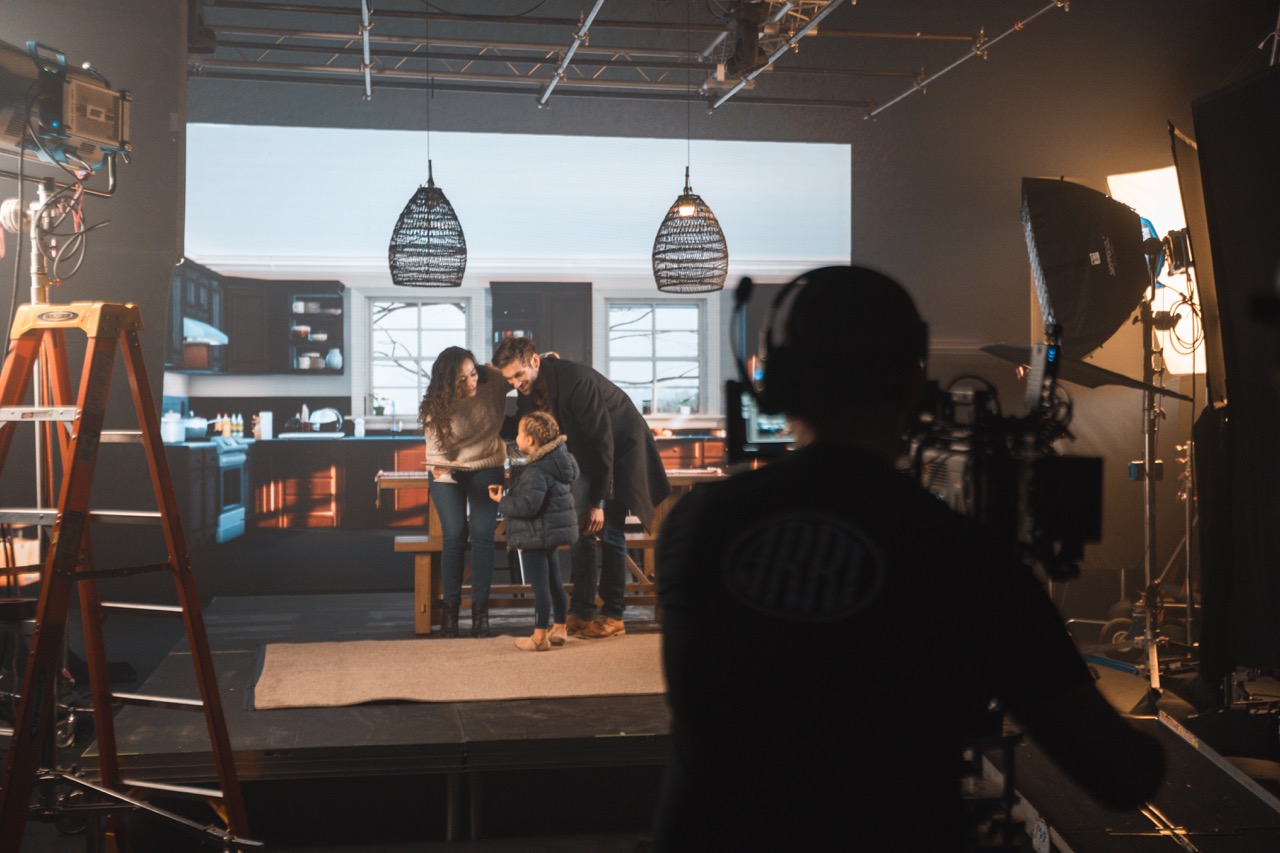 A group of people standing on a stage.