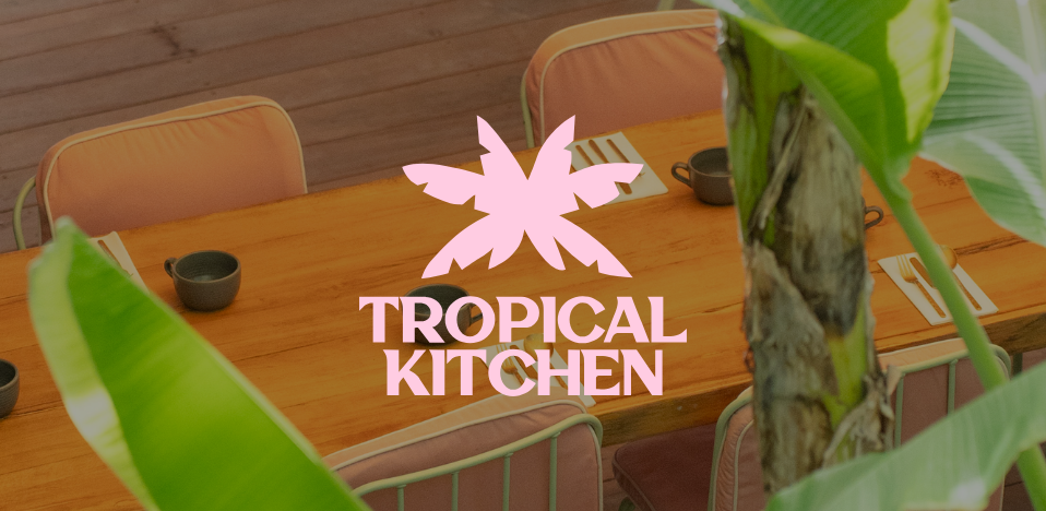 Image of a table at Tropical Kitchen featuring its logo