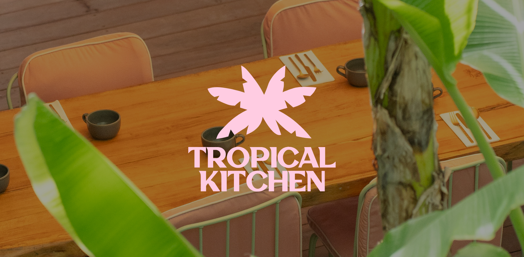 Image of a table at Tropical Kitchen featuring its logo