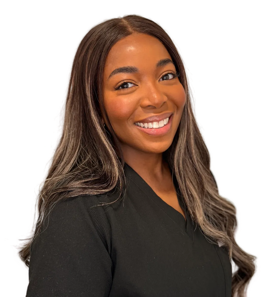 Smiling woman with long dark hair wearing a black medical scrub top.
