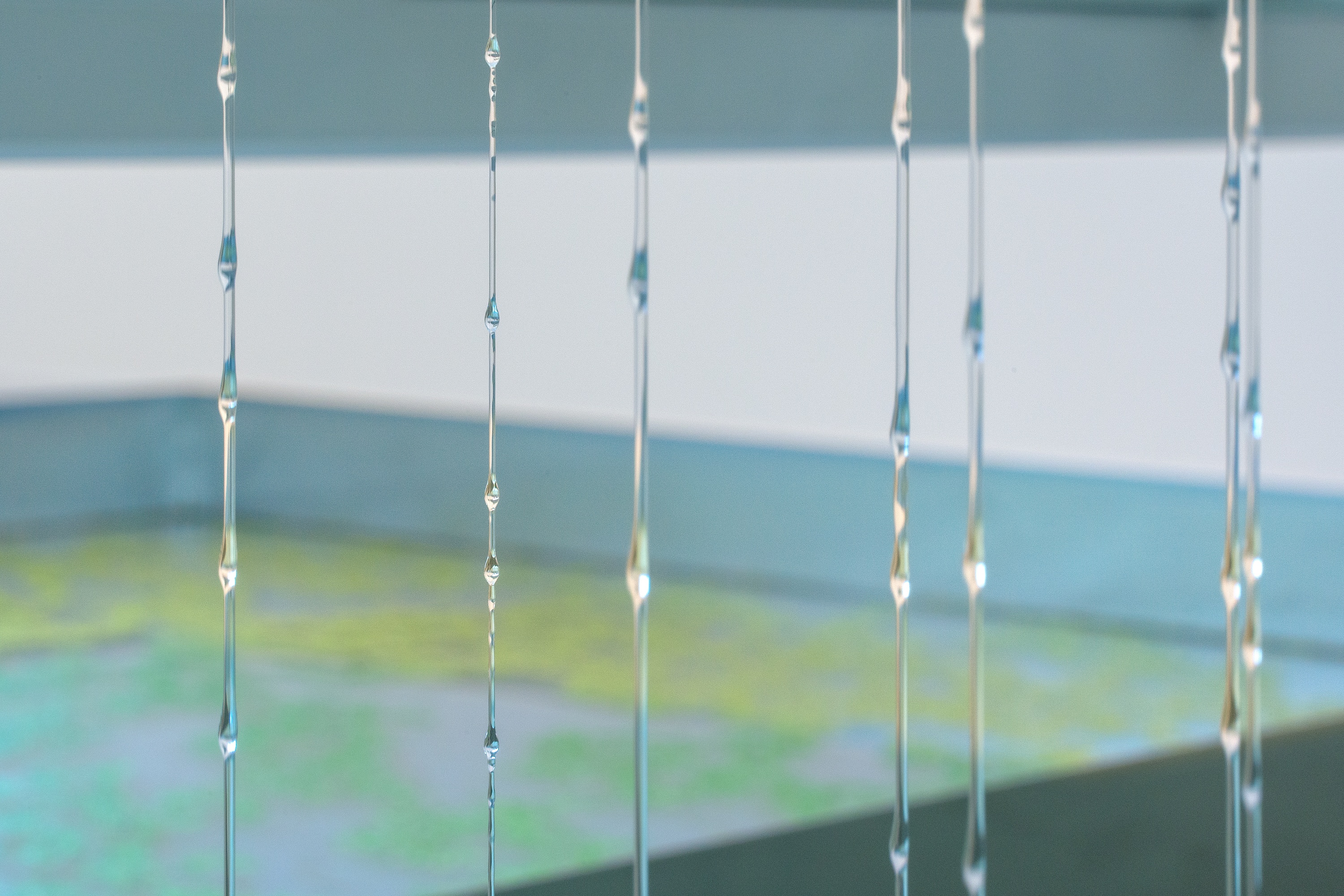 Xin Liu, Insomnia (2025). Aluminum, stainless steel, resin, fibreglass, acrylic, led lights, silicone oil, water, duckweed. Tank: 1260 x 1780 x 350mm. Kinetic systems (each): 150 x 1780 x 1200mm. Courtesy of the artist, Makeroom LA, Public Gallery, London