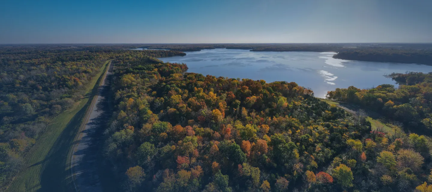 a large body of water surrounded by trees