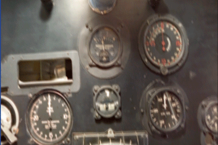 Close-up of a suspended replica aircraft's wing struts and engine housing, the museum object the Spirit of St. Louis AR experience is built on.