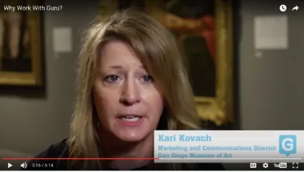 Still from the video Why Work With Guru? showing San Diego Museum of Art marketing and communications director Kari Kovach speaking in a gallery.