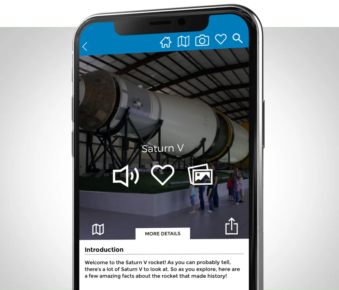 Phone showing a virtual tour item screen for the Saturn V rocket, with audio, favorite and photo gallery buttons above an introduction to the rocket.
