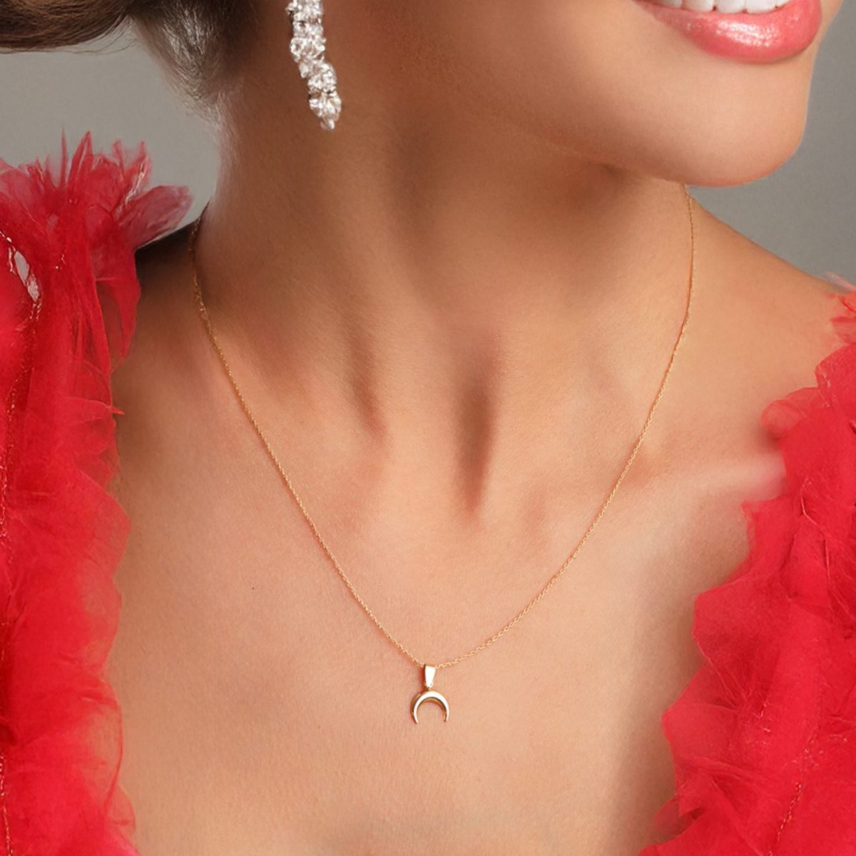Mini horn pendant: 18 kt yellow gold
