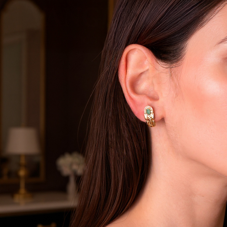 Panter emerald earrings: 18 kt yellow gold