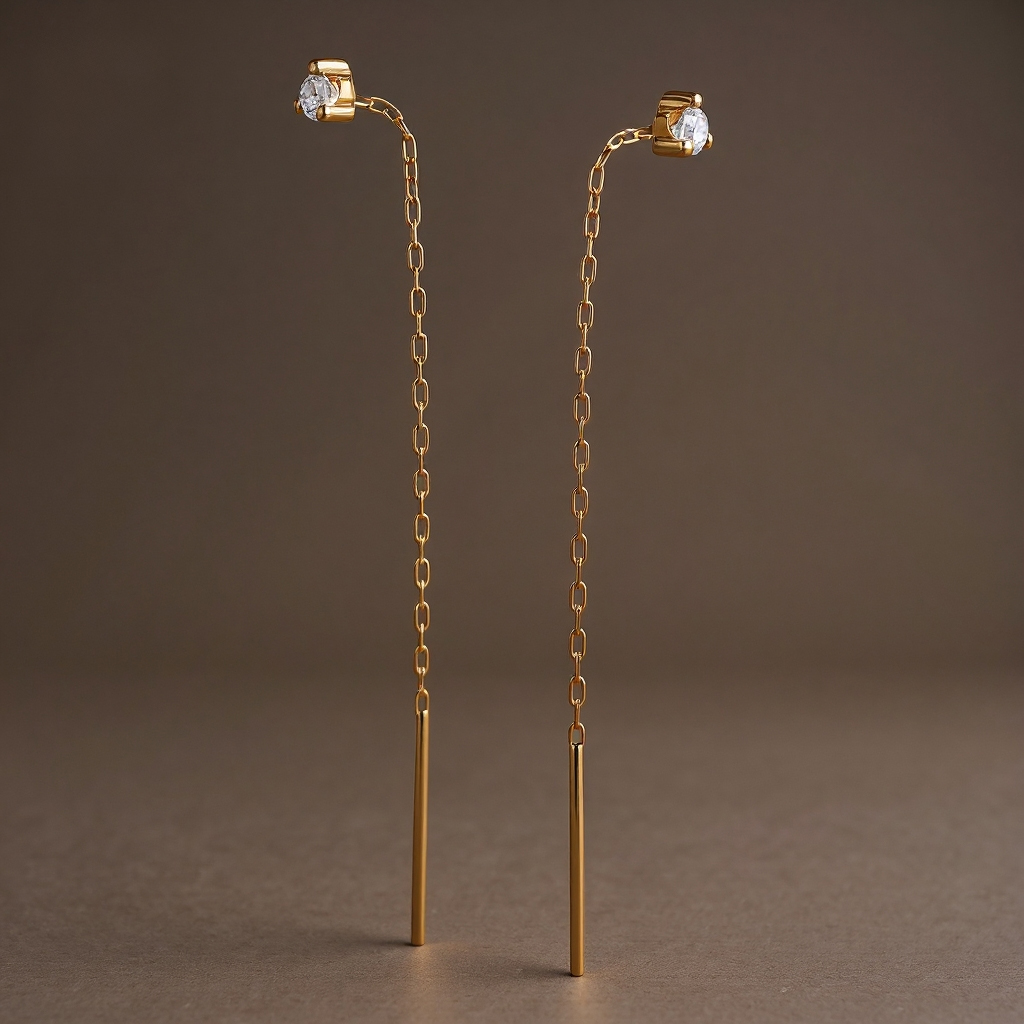 Threader long earrings: 18 kt yellow gold with zirconias