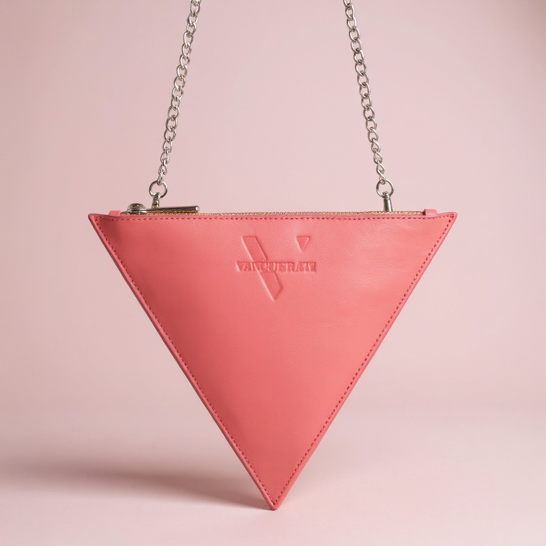 Triangular pale pink leather bag