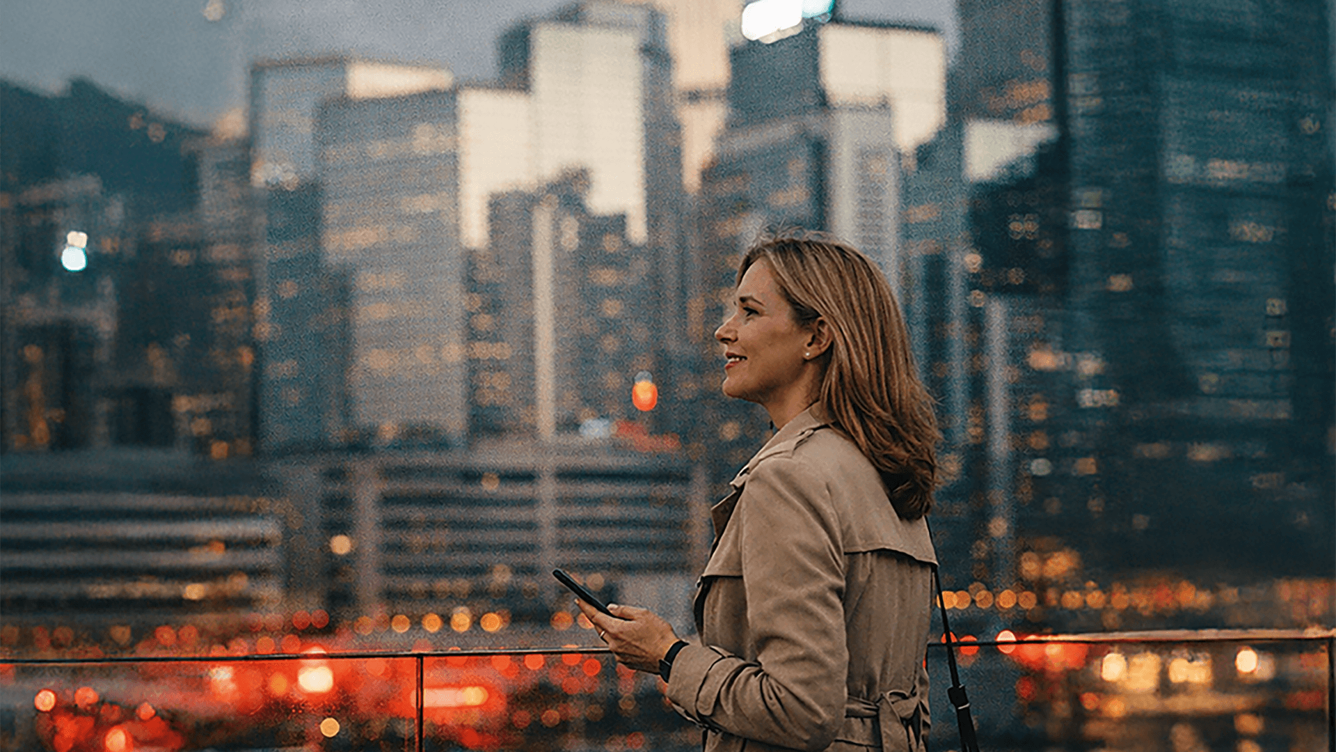 A Euro sign in front of a banking building with stars.