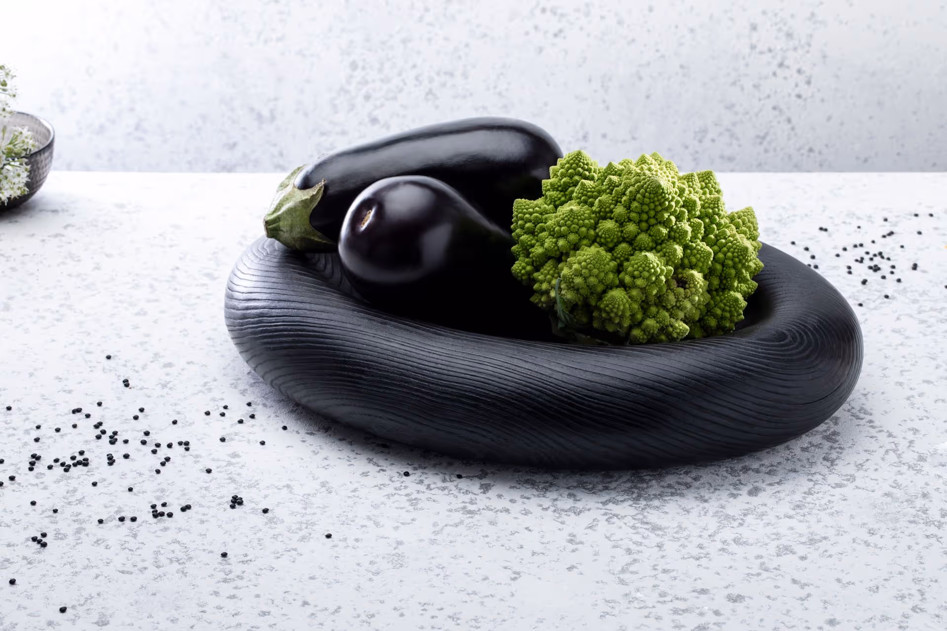 Clong sandblasted oak oval bowl styled in a Scandinavian interior by Anonymia, close-up view