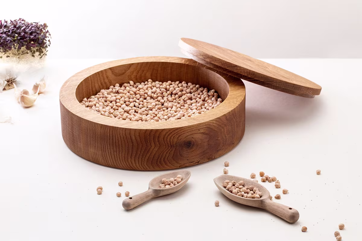 Close-up of handmade wood finishing process by Anonymia, overhead view