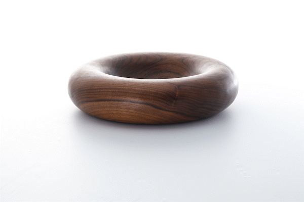 Animated close-up of walnut wood finish by Anonymia, in natural light