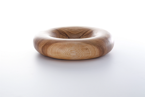 Animated close-up of oiled ash wood finish by Anonymia, styled shot