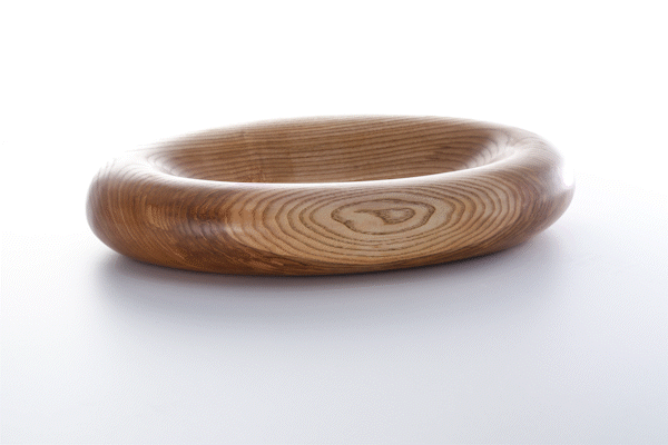 Animated close-up of oiled ash wood finish by Anonymia, in natural light