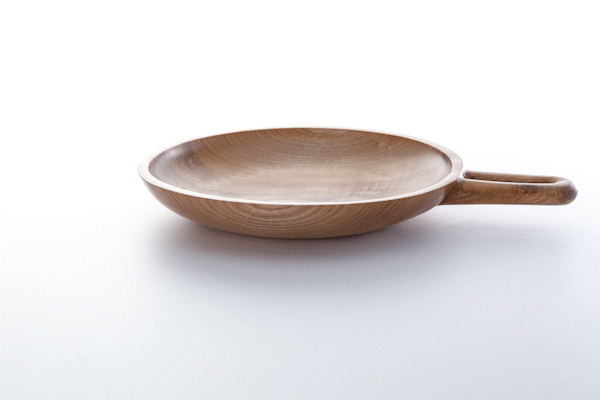 Animated close-up of oiled ash wood finish by Anonymia, product detail view