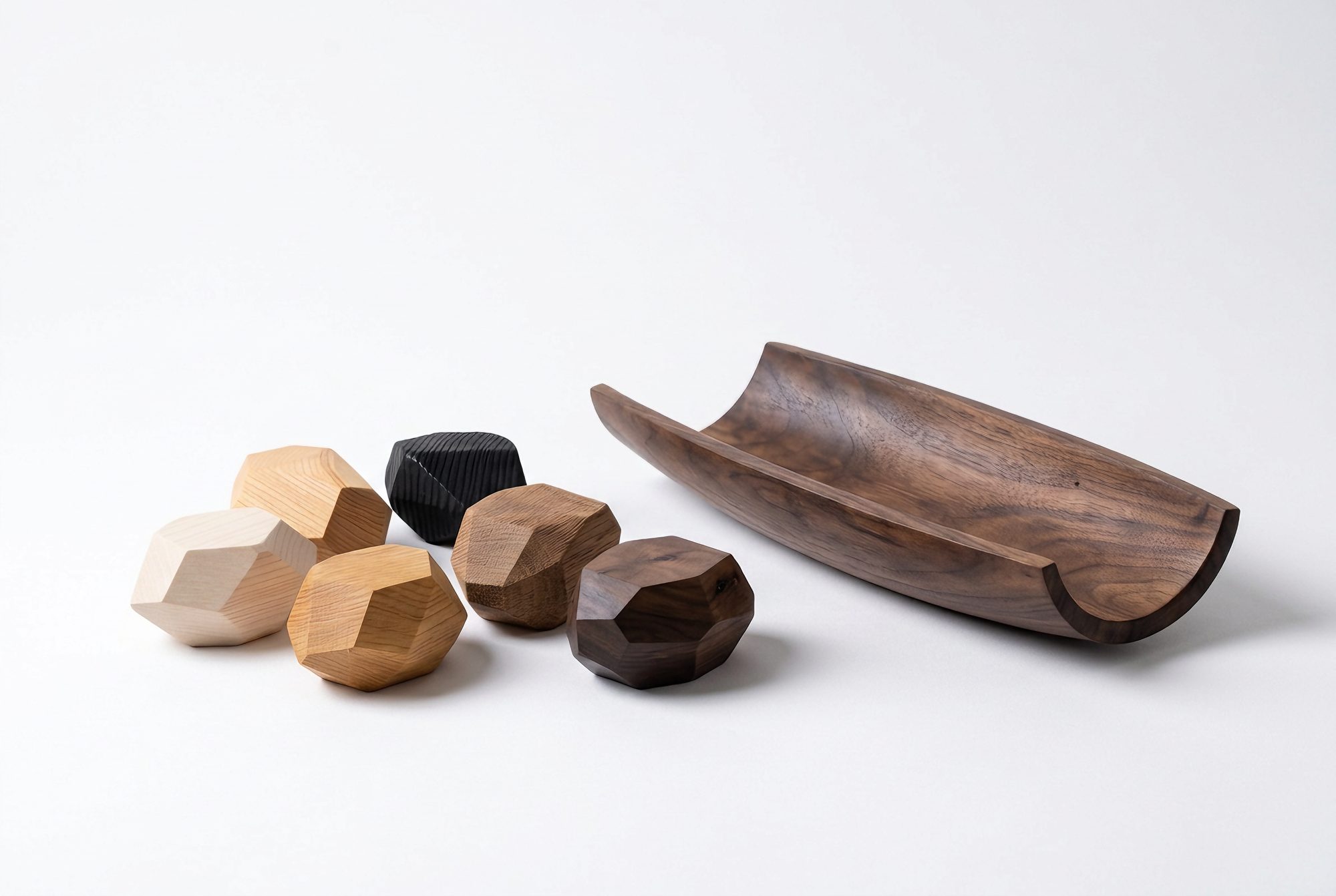 Six Anonymia® sample stones next to the Vrull holder in walnut