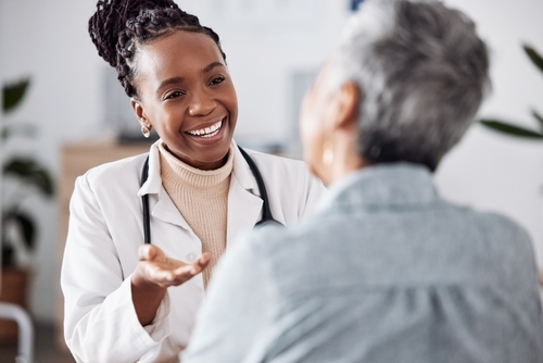 Female doctor talking to patient