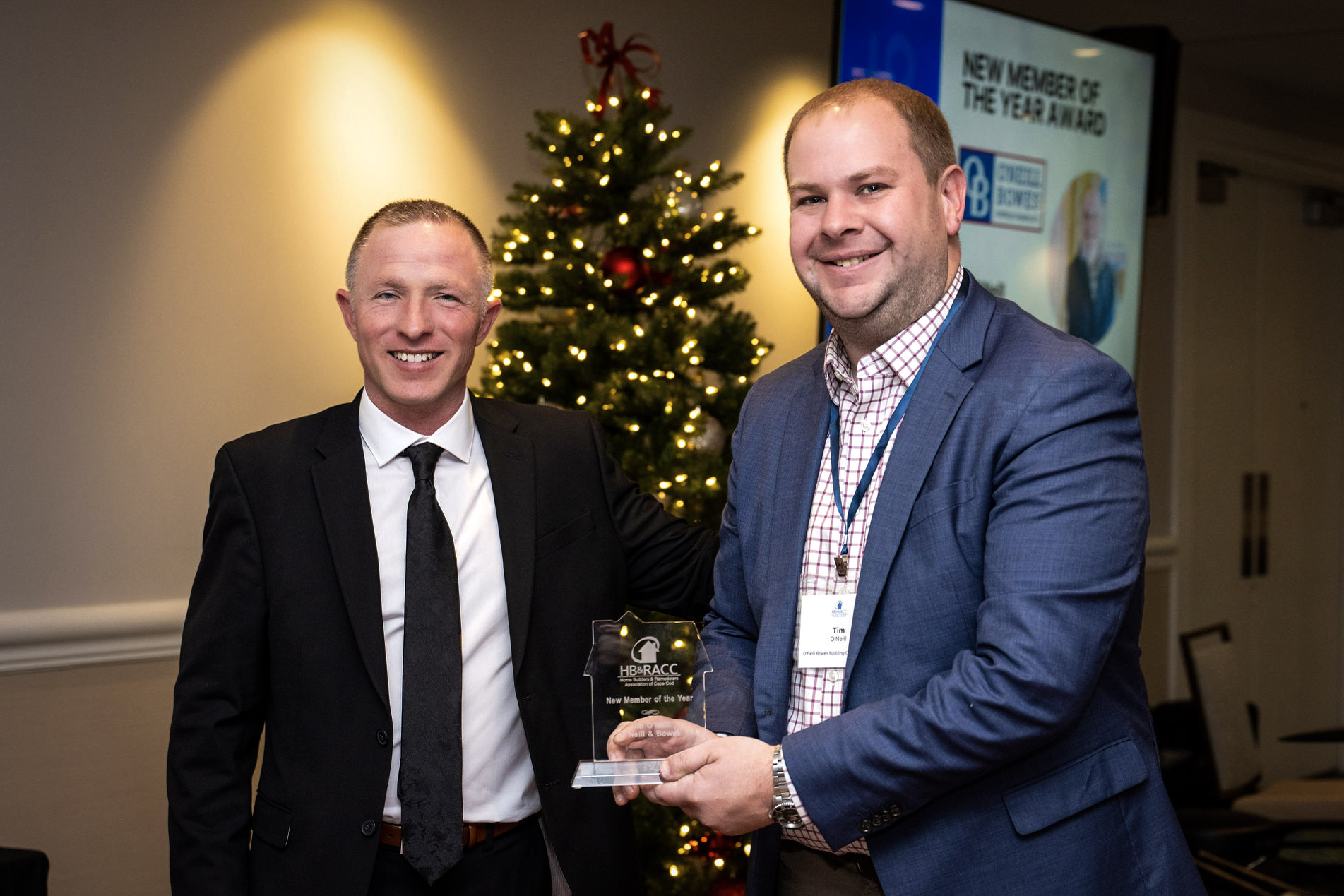 Tim O'Neill of O'Neill Bowes Building Company shows off his award for New Member of the Year by the HBRACC