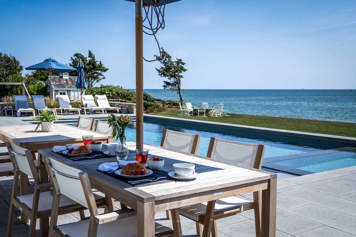 Beautiful outdoor dining area with year round weather treated furniture.