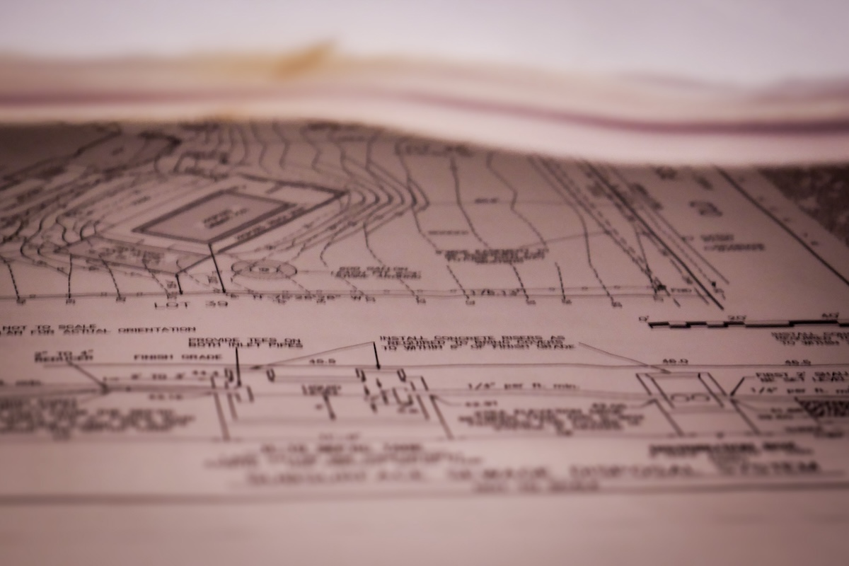 Approved home building plans hang on a blueprint rack at the O'Neill Bowes office.