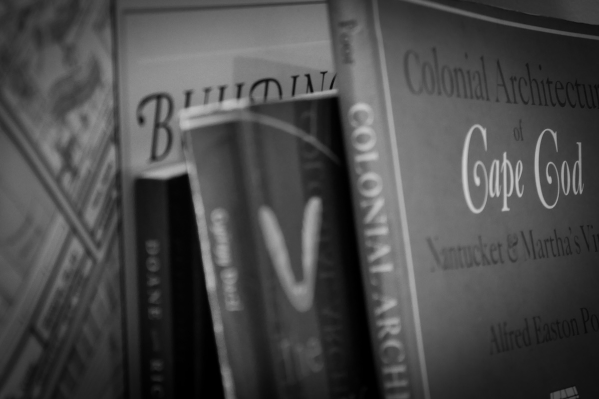 Historic books on building on Cape Cod on the shelves at the O'Neill Bowes Building Company office.