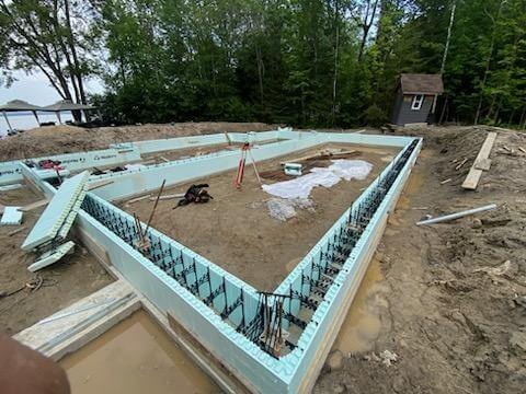 House under construction with helical pile foundations
