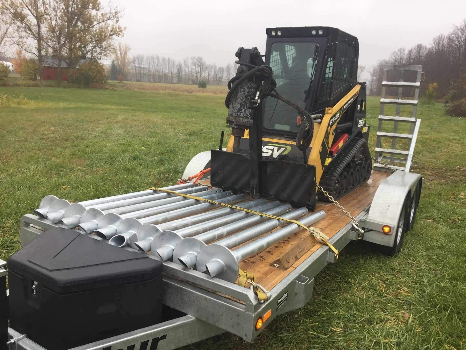 Tractor trailer with skid steer attached
