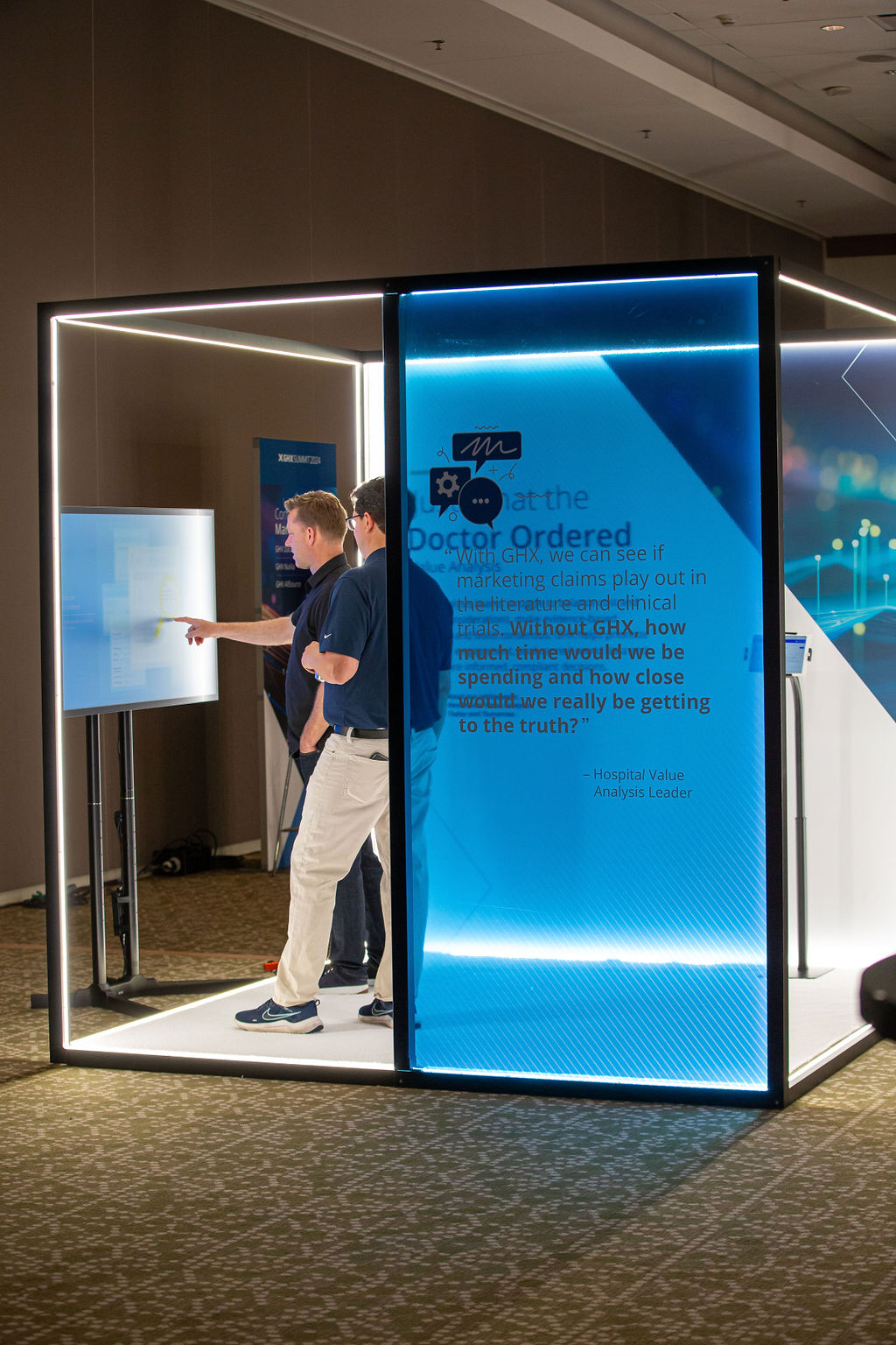 Attendees engage with an Imprint-designed illuminated interactive display at the GHX Summit