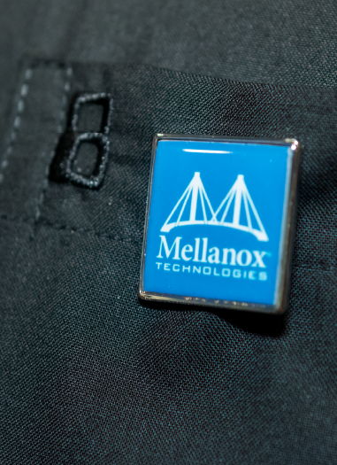 A close-up of a Mellanox Technologies lapel pin at the Imprint-produced Mellanox Conference