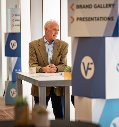 An investor explores Imprint's popup brand gallery wayfinding at VF Corporation's Investor Day