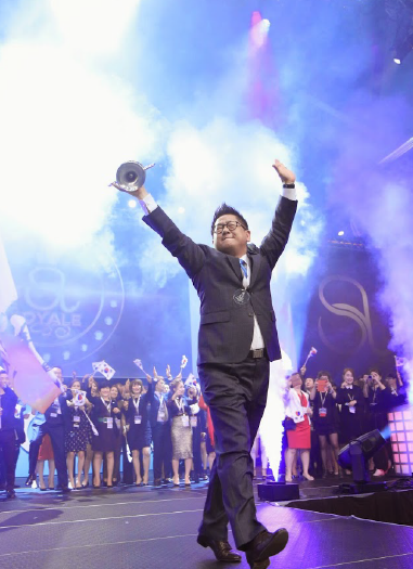An award winner celebrates on stage during Imprint's produced awards moment at the Seacret Conference