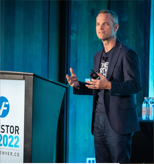 A speaker presents on Imprint's branded stage at VF Corporation's Investor Day