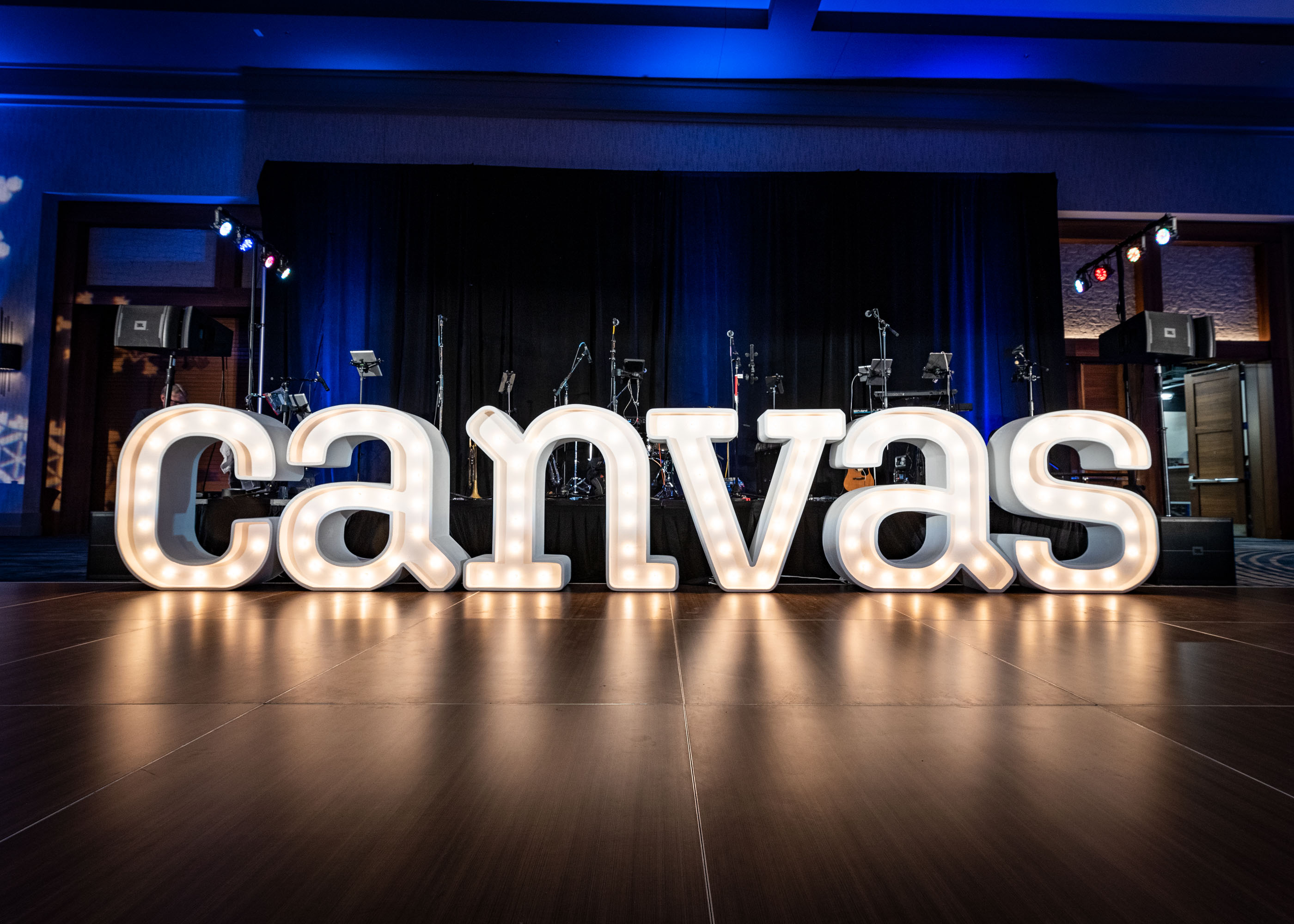 Imprint's marquee letter installation lights the dance floor at the Canvas Holiday Party
