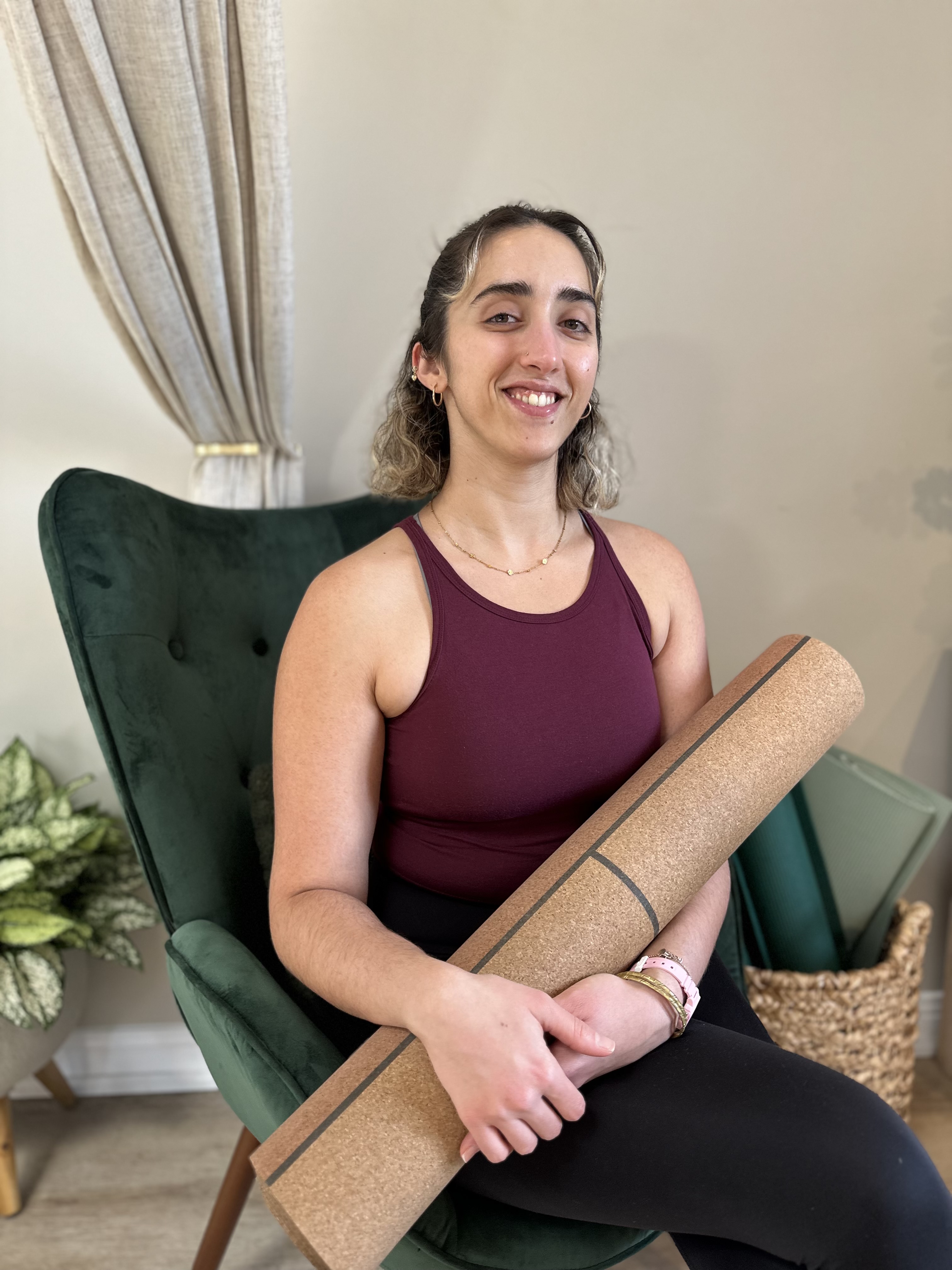 Certified Yoga Therapist Emma Seston practicing Yoga as offered at Embark Physical Therapy & Wellness in Kitchener-Waterloo