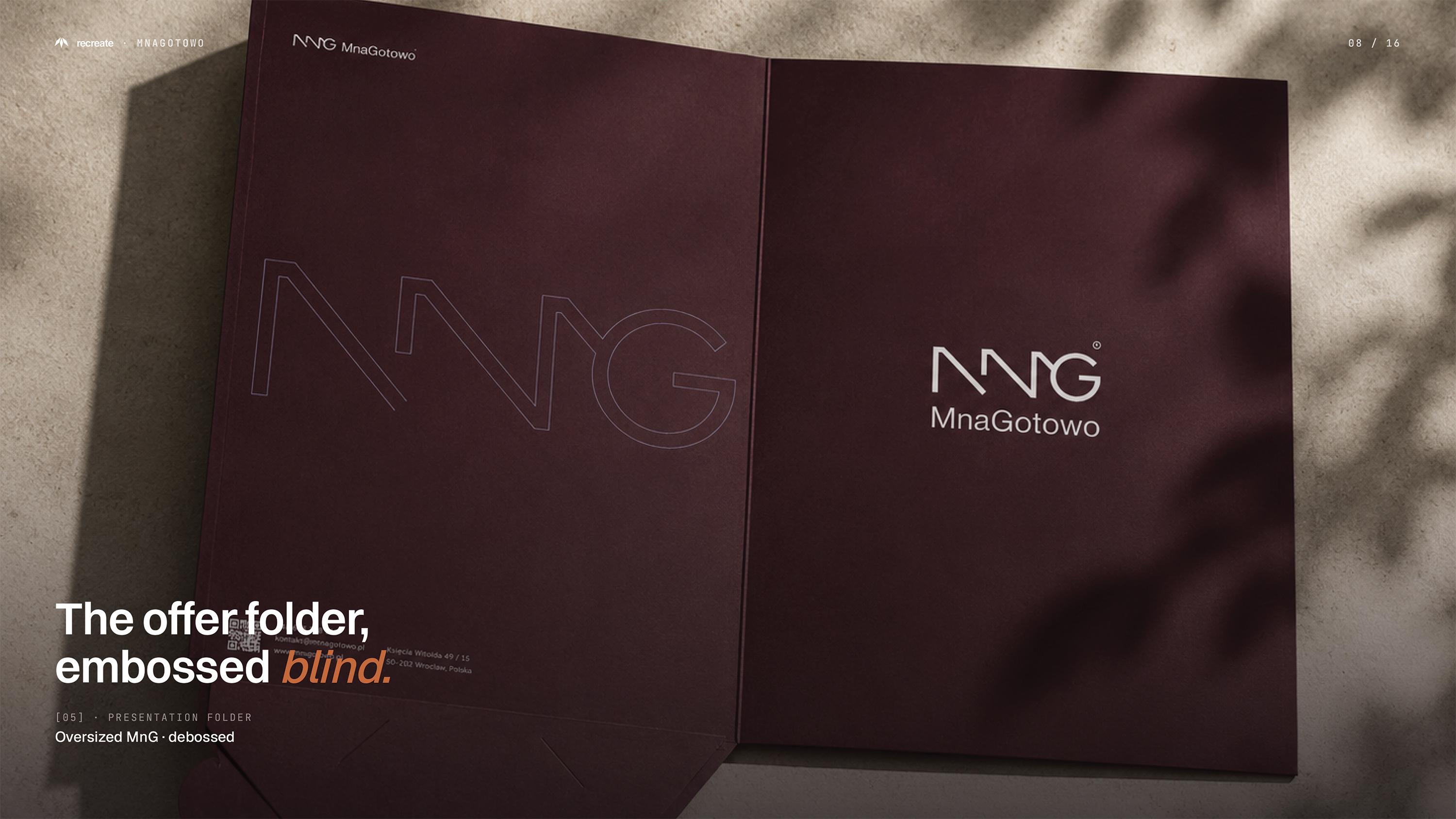 MnaGotowo presentation folder — dark oxblood with blind debossed oversized MnG monogram