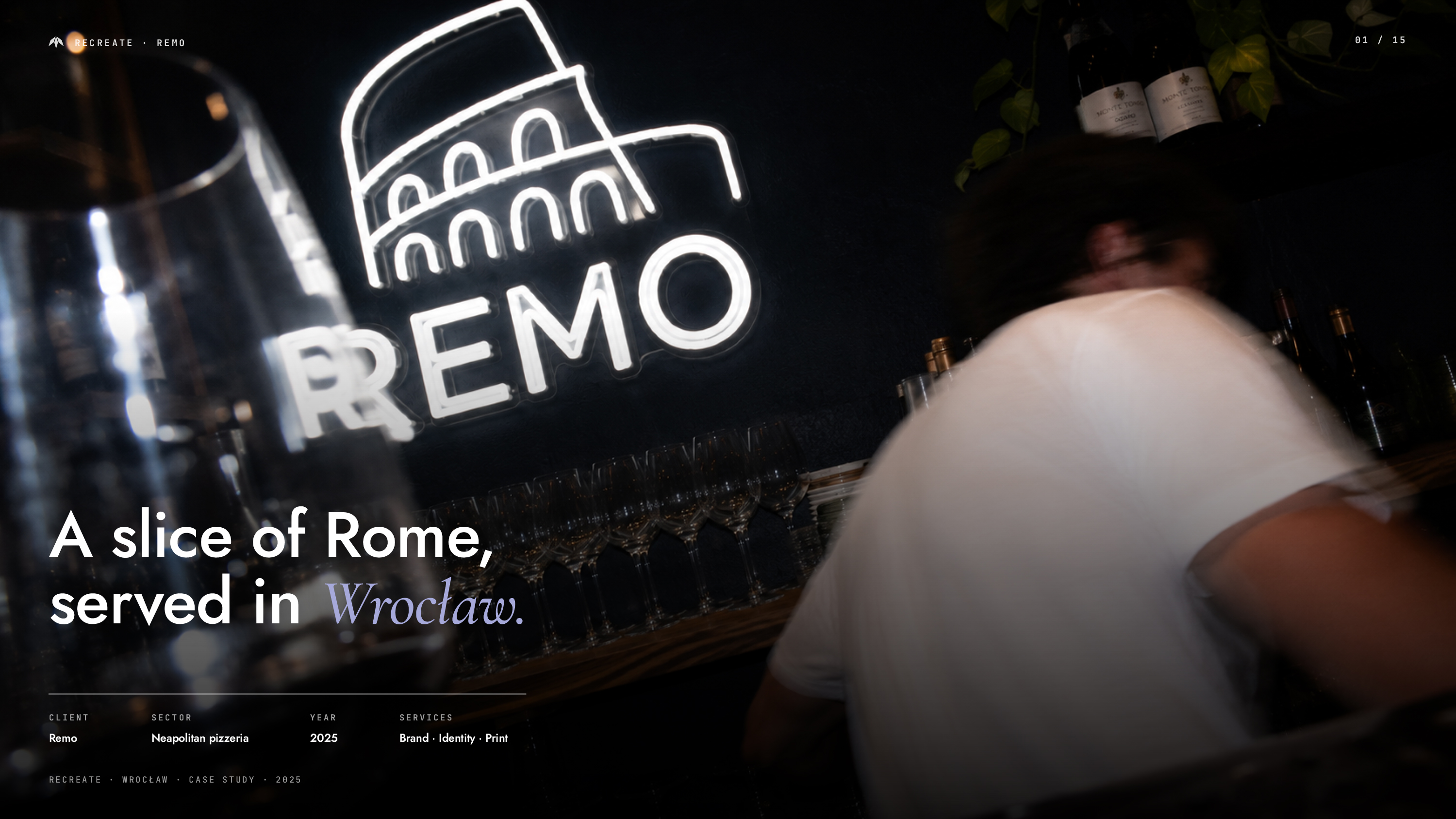 REMO pizzeria branding with neon logo inside the restaurant in Wrocław