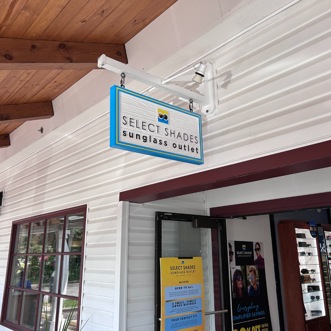 Select Shades Sunglass Outlet storefront at Lake George, NY – family-owned designer sunglasses store offering Ray-Ban, Oakley, and more at outlet prices near Adirondack shopping district.