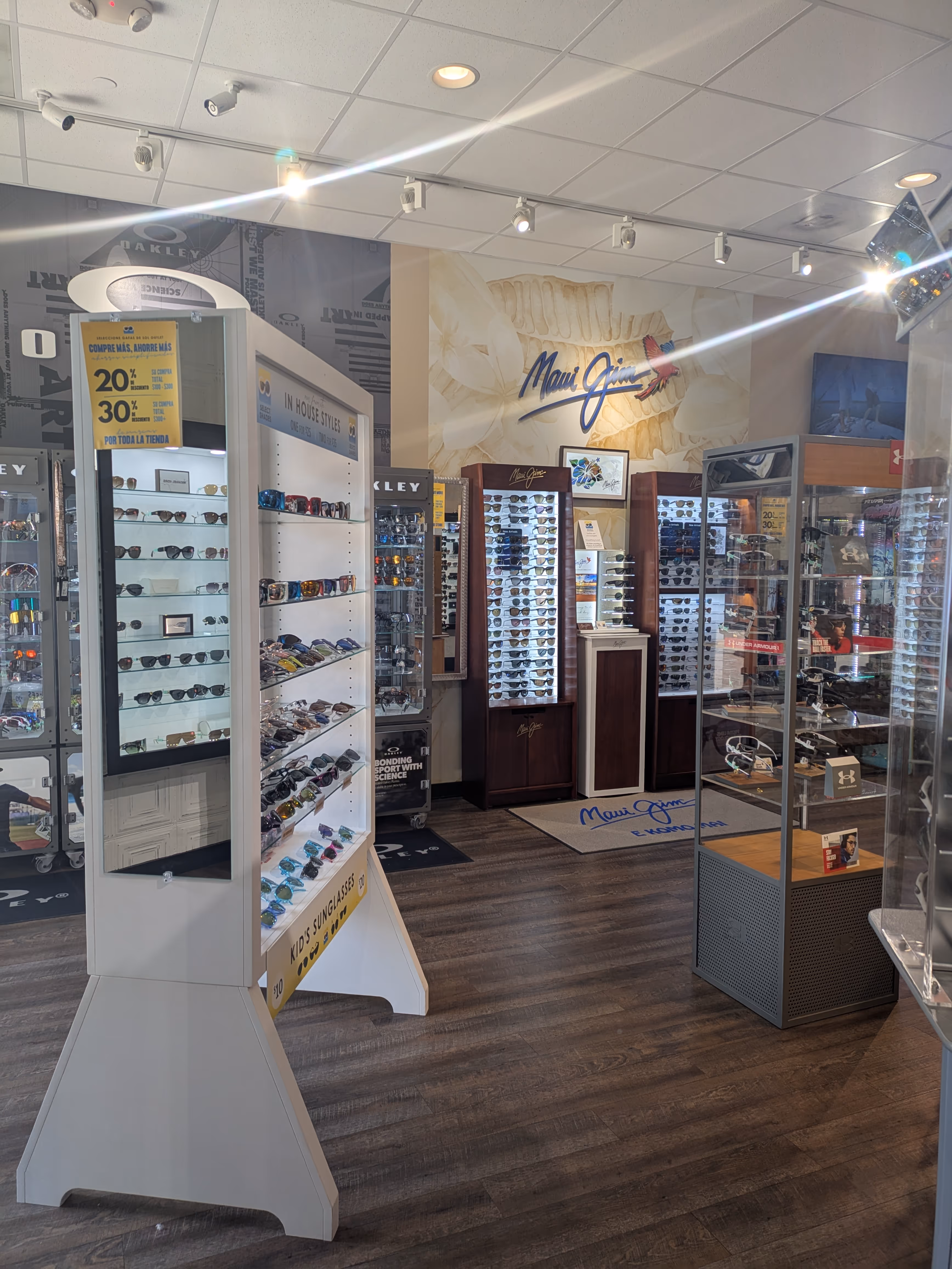 Assorted premium sunglass brands at Select Shades Sunglass Outlet Fort Worth, including Costa, Ray-Ban sunglasses, and inexpensive sunglasses