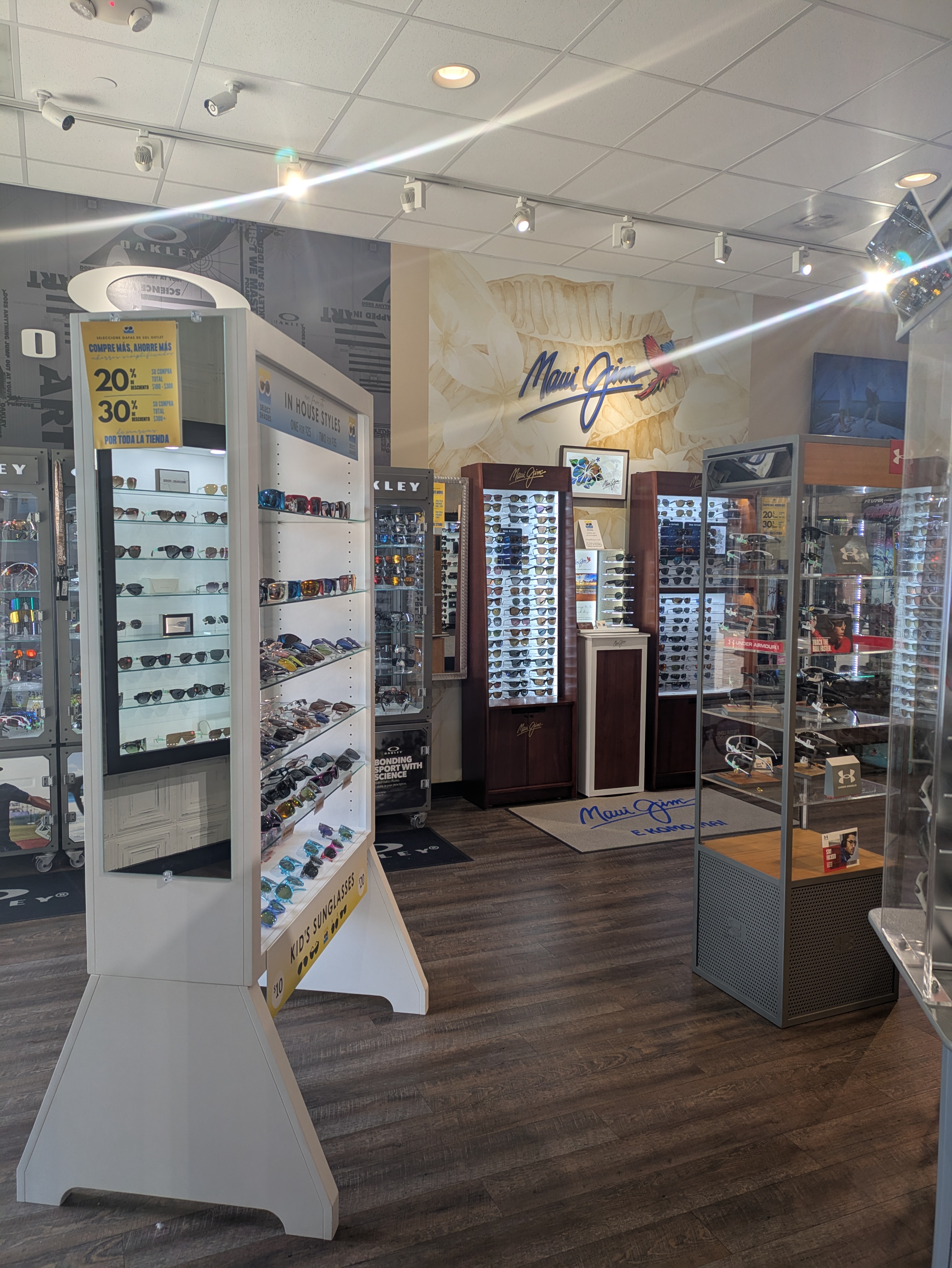 Assorted premium sunglass brands at Select Shades Sunglass Outlet Fort Worth, including Costa, Ray-Ban sunglasses, and inexpensive sunglasses