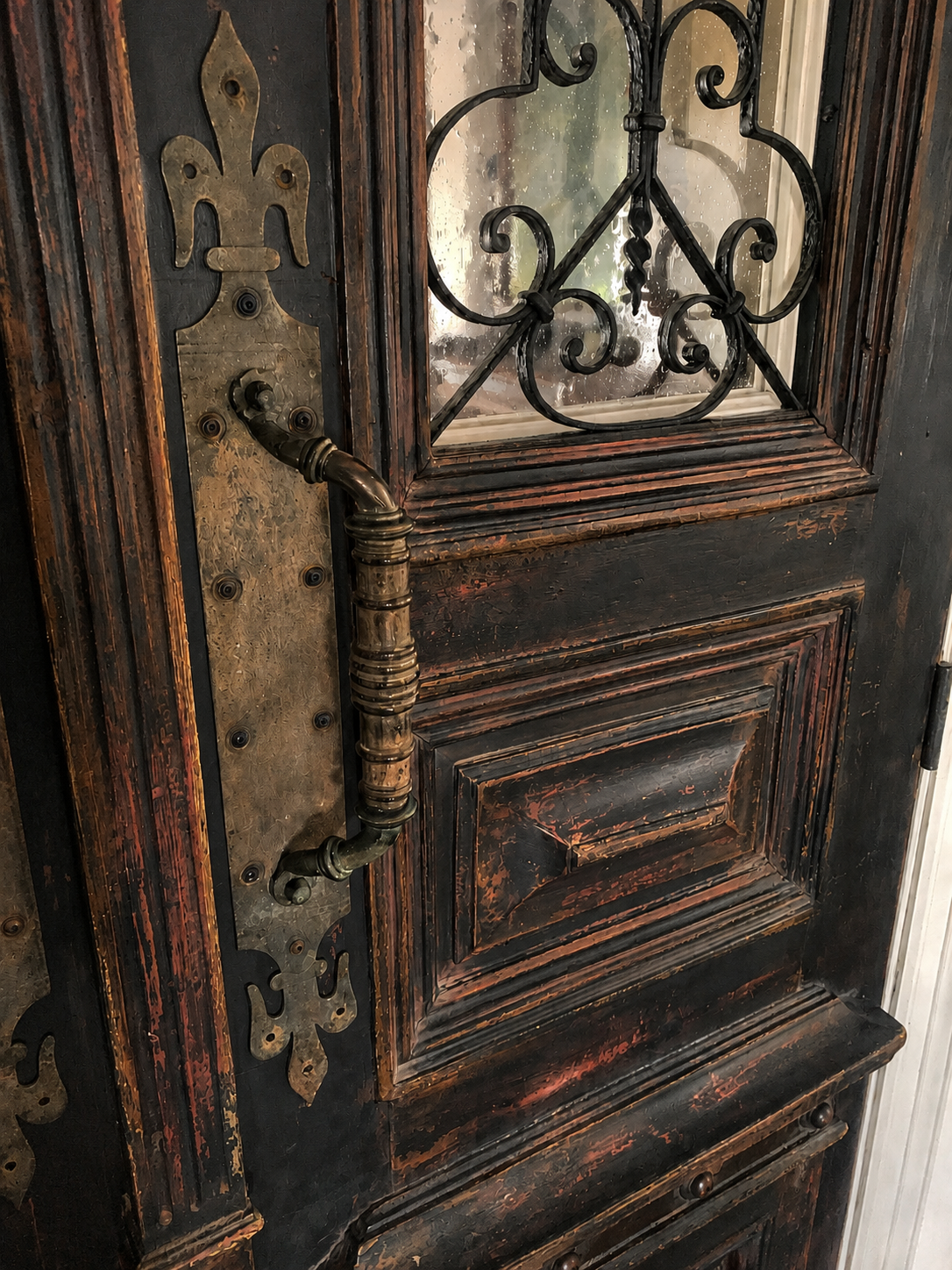 Black door detail with hardware