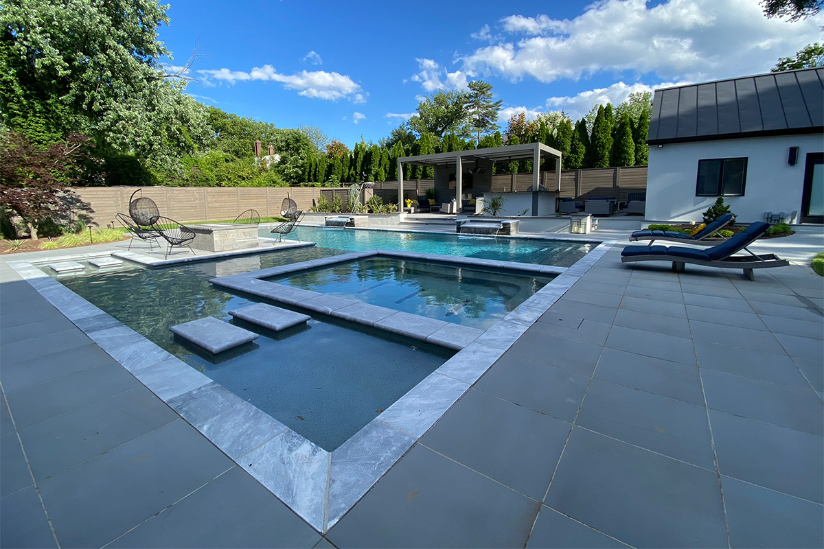 A resort-caliber backyard complete with a beautiful pool, built and designed by Rossen Landscape.