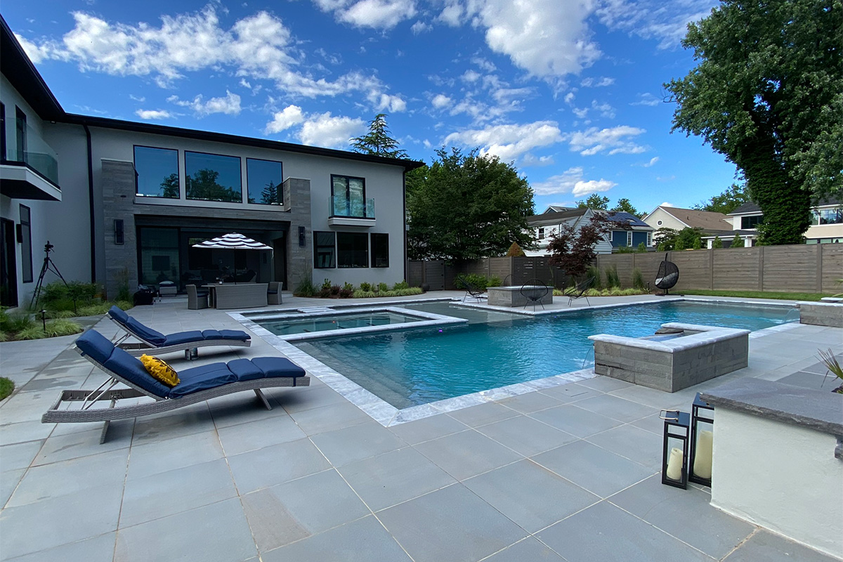 A resort-caliber backyard complete with a beautiful pool, built and designed by Rossen Landscape.
