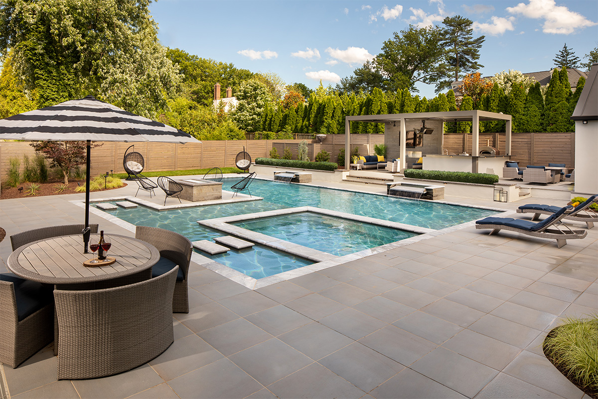 A resort-caliber backyard complete with a beautiful pool, built and designed by Rossen Landscape.