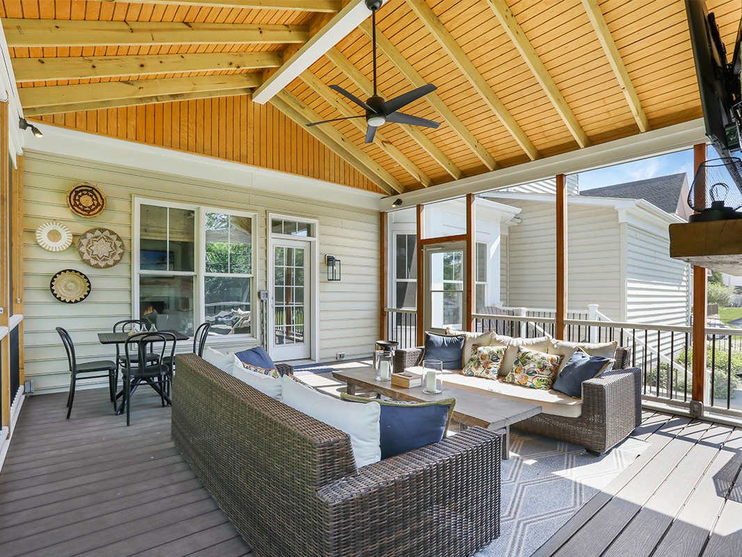 Gorgeous backyard retreat with a covered, screened in porch. This project was designed and built by Rossen Landscape.