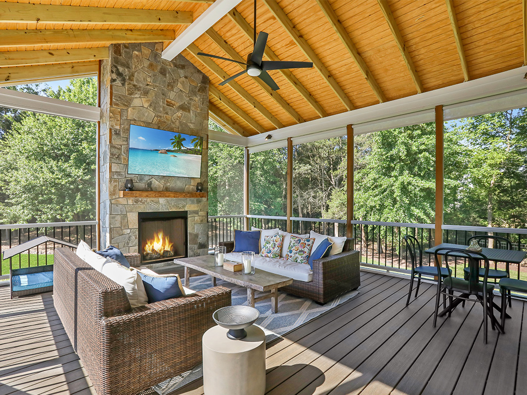Gorgeous backyard retreat with a covered, screened in porch. This project was designed and built by Rossen Landscape.