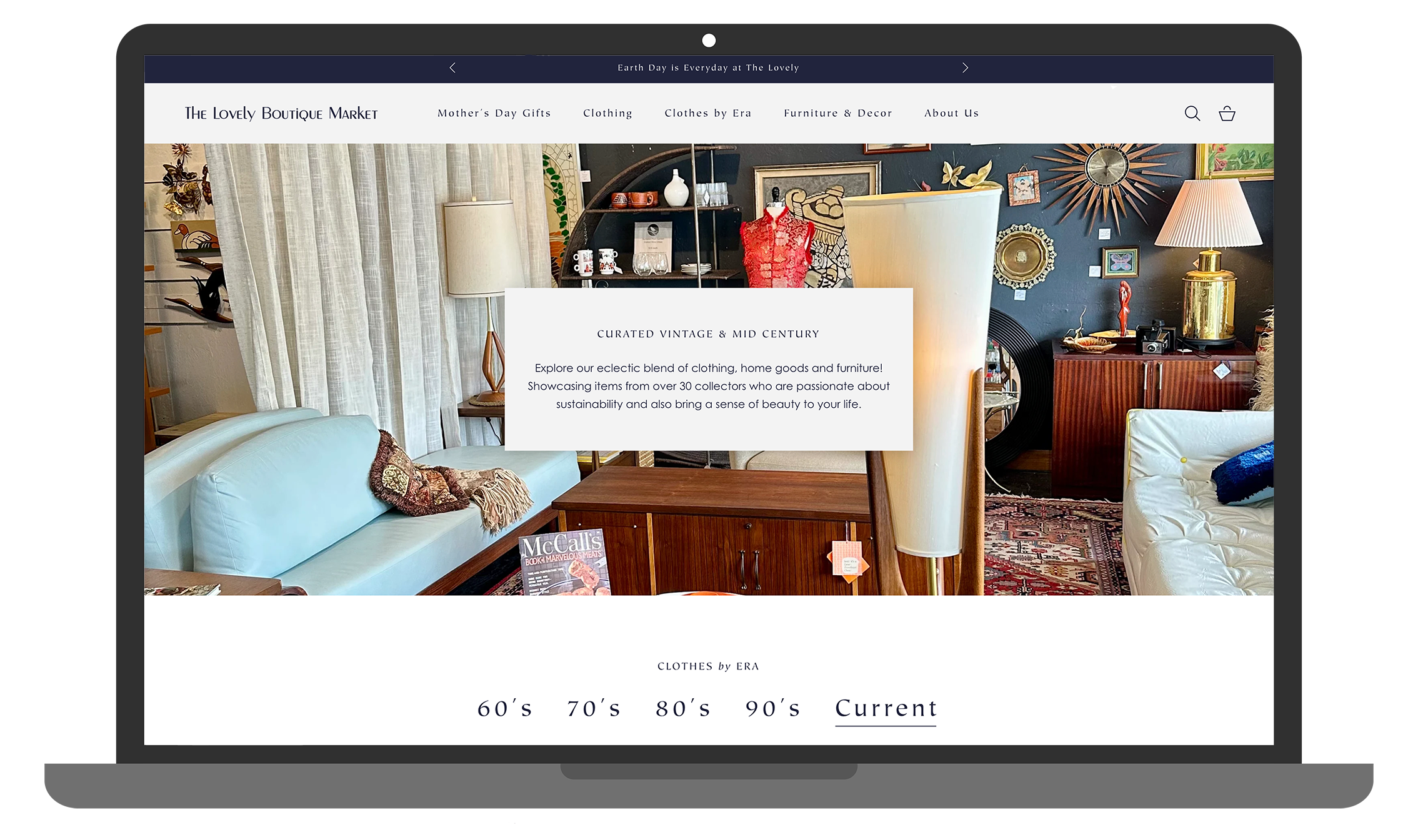 A desktop laptop showing the homepage of a website with a large promotional image of furniture