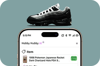 Smartphone screen displaying Hobby Hubby AI app with a listed item and a black and silver Nike Air Max sneaker placed on top of the phone.