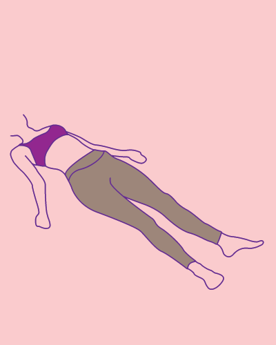 Woman in relaxtion pose during yoga class.