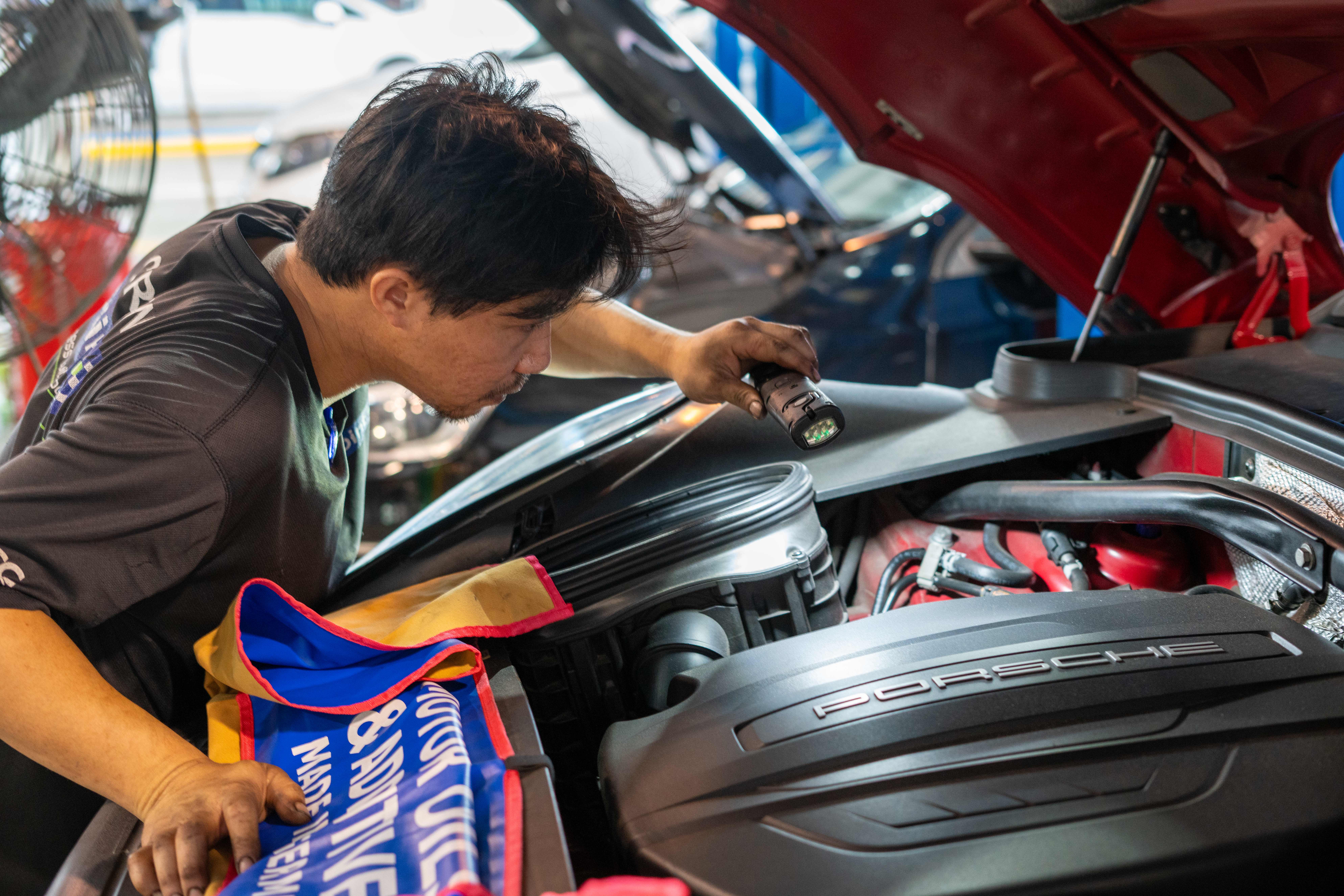 Image of Mechanic Inspecting Car
